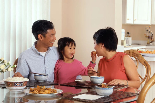 asian family eating dinner at home